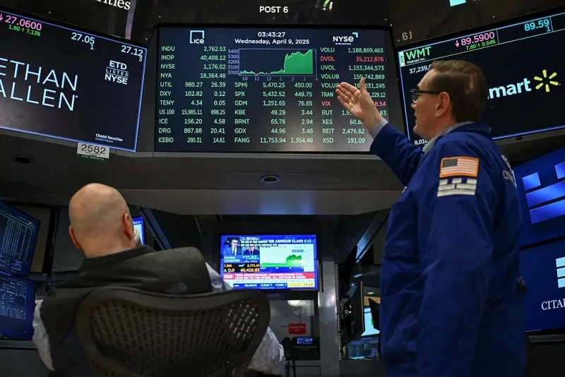 Traders work on the floor of the New York Stock Exchange (NYSE) during afternoon trading on April 9, 2025 in New York. Wall Street stocks rocketed to close solidly higher Wednesday, with dramatic advances on all three major indexes as US President Donald Trump delayed steep new tariffs hours after they took effect. The Dow Jones Industrial Average surged 7.9 percent to 40,608.45, the broad-based S&P 500 Index rallied 9.5 percent to 5,456.90, and the tech-focused Nasdaq Composite Index jumped more than 12.2 percent to 17,124.97. (Photo by ANGELA WEISS / AFP) (Photo by ANGELA WEISS/AFP via Getty Images)