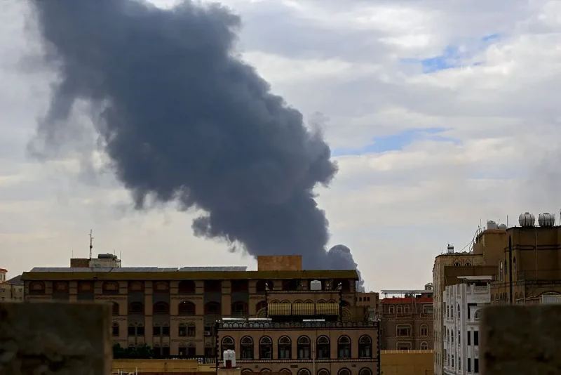 Smoke billows on the horizon following an Israeli air strike on Yemen's Huthi-held capital Sanaa on May 6, 2025. Israeli air raids struck Yemen's main airport and power stations in the Sanaa area on May 6, Huthi media and Israel's military said, the latest retaliation for a missile attack by the Iran-backed rebels. (Photo by Mohammed HUWAIS / AFP) (Photo by MOHAMMED HUWAIS/AFP via Getty Images)
