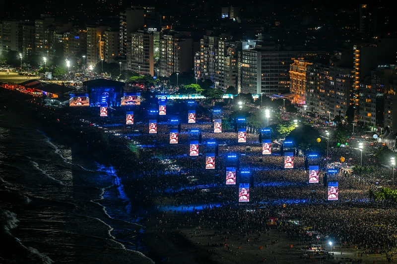 US pop star Lady Gaga is projected on big screens as she performs during her concert at Copacabana beach in Rio de Janeiro, Brazil on May 3, 2025. (Photo by Mauro PIMENTEL / AFP) (Photo by MAURO PIMENTEL/AFP via Getty Images)