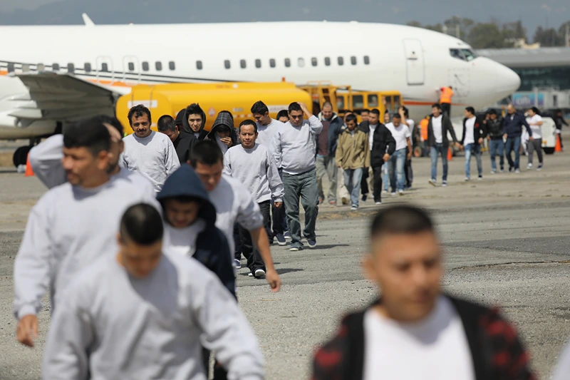 GUATEMALA CITY, GUATEMALA - FEBRUARY 09: Guatemalan immigrants deported from the United States arrive on a ICE deportation flight on February 9, 2017 in Guatemala City, Guatemala. The charter jet, carrying 135 deportees, arrived from Texas, where U.S. border agents catch the largest number illigal immigrants crossing into the United States, many of them from Central America. U.S. President Donald Trump pledged to vastly increase the number of deportations. (Photo by John Moore/Getty Images)