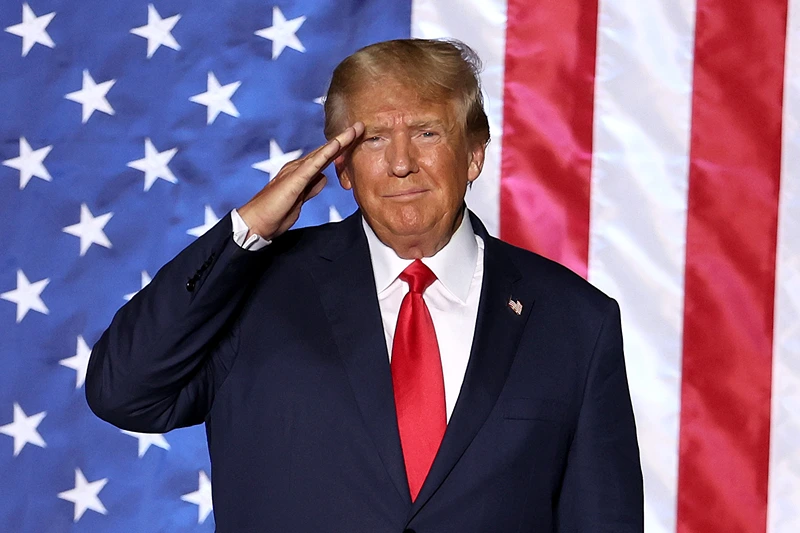 U.S. President Donald Trump salutes supporters during a campaign rally at Minden-Tahoe Airport on October 08, 2022 in Minden, Nevada. Former U.S. President Donald Trump held a campaign style rally for Nevada GOP candidates ahead of the state's midterm election on November 8th. (Photo by Justin Sullivan/Getty Images)