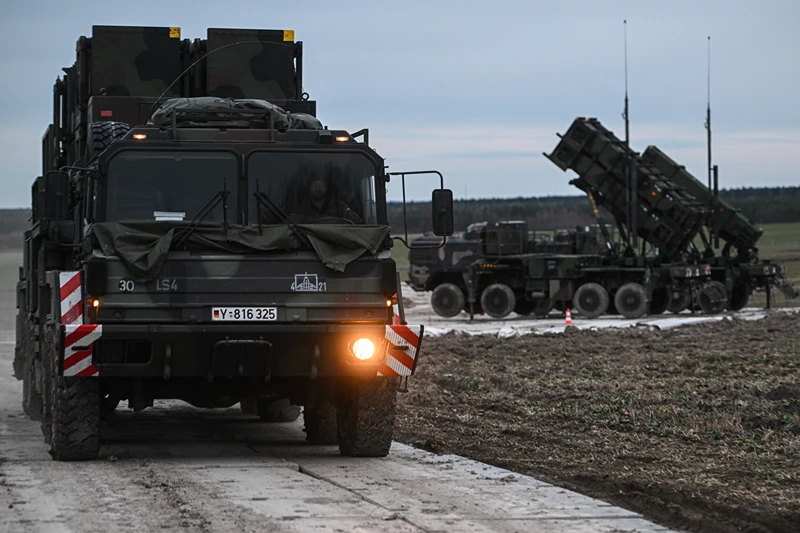 ZAMOSC, POLAND - FEBRUARY 18: A German soldier drives a M983 HEMTT carrying a Patriot launcher module part of the US made MIM-104 Patriot surface-to-air missile (SAM) system on a open field on February 18, 2023 in Zamosc, Poland. The German armed forces deployed Patriots batteries to their NATO neighbor, after a missile explosion in Przewodow, which previous investigation suggests that came from Ukrainian air defense, killed two civilians. Since Russia's large scale military attack on Ukraine on February 24, 2022 more than 9.7 million refugees from Ukraine crossed the Polish borders to escape the conflict, with 1.4 million registering in Poland whilst others moved on to other countries. (Photo by Omar Marques/Getty Images)
