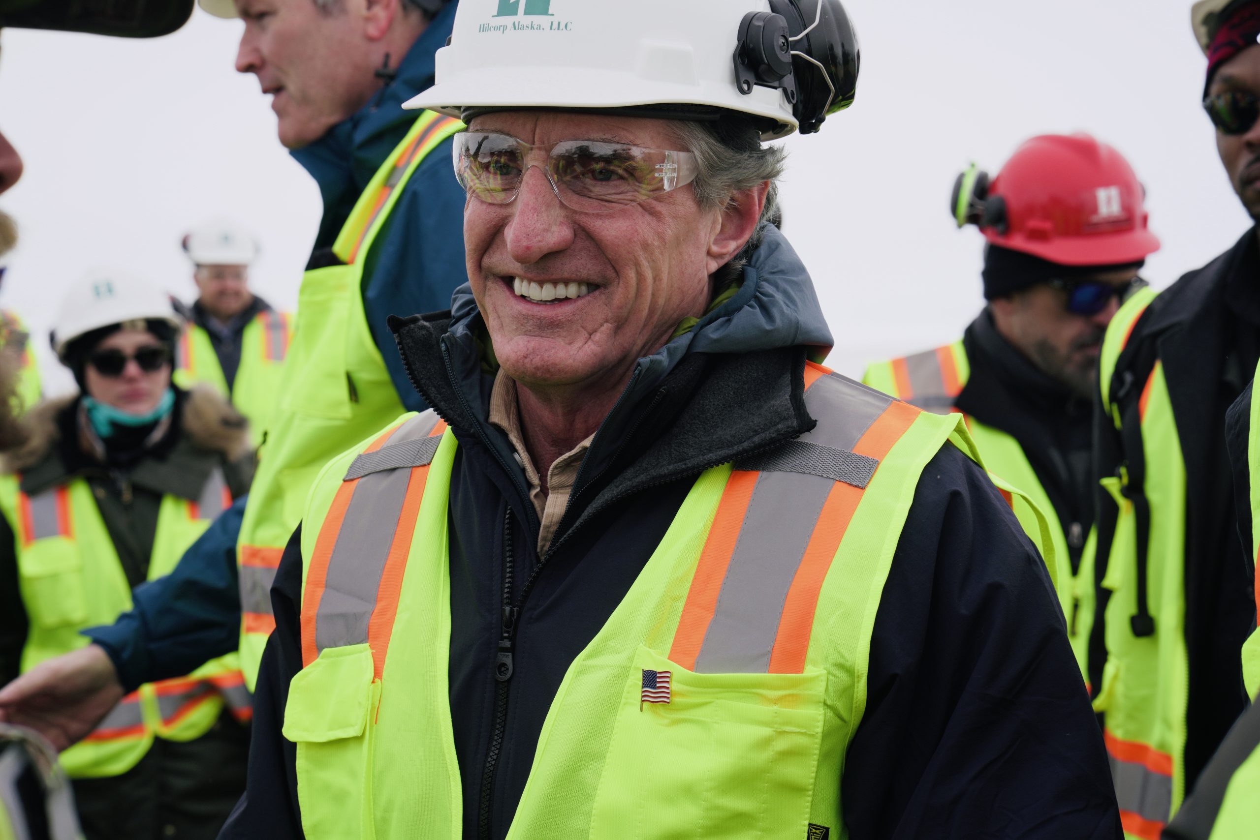 Interior Secretary speaks with oil workers following the event in Deadhorse, Alaska, on Monday.