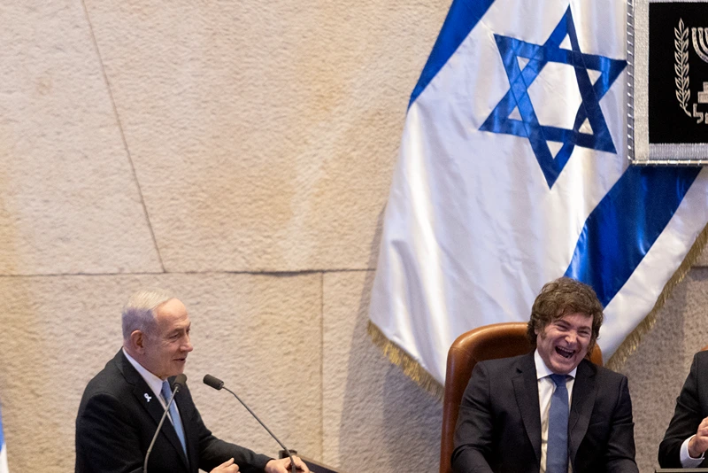 JERUSALEM - JUNE 11: Israeli Prime Minister, Benjamin Netanyahu, greets Argentinian President Javier Milei as he attends a special address to the Israeli Knesset on June 11, 2025 in Jerusalem. (Photo by Amir Levy/Getty Images)