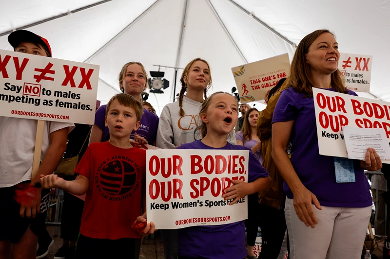 WASHINGTON, DC - JUNE 23: Demonstrators cheer during the speaking program at the "Our Bodies, Our Sports" rally for the 50th anniversary of Title IX at Freedom Plaza on June 23, 2022 in Washington, DC. The rally, organized by multiple athletic women's groups was held to call on U.S. President Joe Biden to put restrictions on transgender females and "advocate to keep women's sports female."(Photo by Anna Moneymaker/Getty Images)