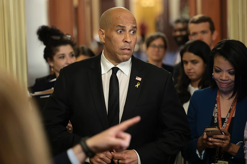 WASHINGTON, DC - APRIL 01: U.S. Sen. Cory Booker (D-NJ) speaks to reporters as he leaves the Senate Chamber after delivering a record setting floor speech at the U.S. Capitol on April 01, 2025 in Washington, DC. Booker spoke on the Senate floor for more than 25 hours protesting President Trump’s agenda, breaking a record set by Sen. Strom Thurmond's 24 hour, 18 minute filibuster against the Civil Rights Act in 1957. (Photo by Win McNamee/Getty Images)