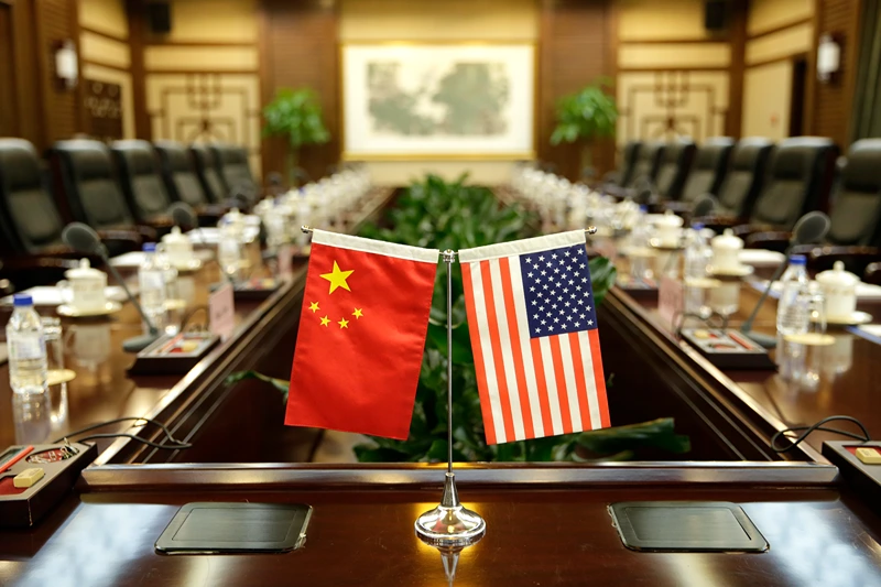Flags of the US and China are placed ahead of a meeting between US Secretary of Agriculture Sonny Perdue and China's Agriculture Minister Han Changfu at the Ministry of Agriculture in Beijing on June 30, 2017. China opened its gates to US beef imports last week, giving US cattle farmers much sought-after access to the country's massive market following a 14-year ban. / AFP PHOTO / POOL / JASON LEE (Photo credit should read JASON LEE/AFP via Getty Images)