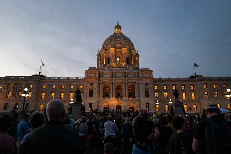 ST. PAUL, MINNESOTA - JUNE 18: People attend a candlelight vigil outside the state Capitol building on June 18, 2025 in St. Paul, Minnesota. Law enforcement agencies captured Vance Boelter on June 15th in connection with the killing of DFL State Rep. Melissa Hortman and her husband, Mark Hortman, who were shot at their home on June 14th. DFL State Sen. John Hoffman and his wife were also shot and hospitalized in a separate incident. Minnesota Gov. Tim Walz said during a press conference that the shooting "appears to be a politically motivated assassination." (Photo by Stephen Maturen/Getty Images)
