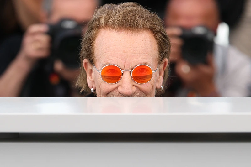 TOPSHOT - Irish singer of U2 Bono poses during a photocall for the film "Bono: Stories of Surrender" at the 78th edition of the Cannes Film Festival in Cannes, southern France, on May 17, 2025. (Photo by Sameer AL-DOUMY / AFP) (Photo by SAMEER AL-DOUMY/AFP via Getty Images)