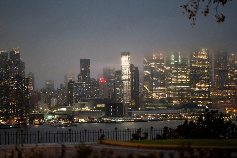 WEEHAWKEN, NEW JERSEY - SEPTEMBER 29: The New York skyline is covered with clouds during a coastal storm on September 29, 2023 as seen from Weehawken, New Jersey. Flash flooding is expected in the counties of Nassau, Queens and Kings, which includes Brooklyn, according to the state