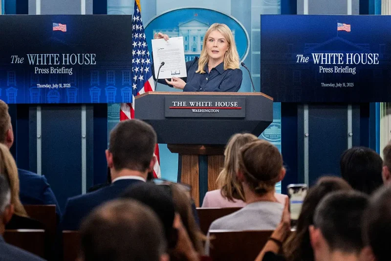 White House Press Secretary Karoline Leavitt displays a letter addressed to US pharmaceutical company Eli Lilly from President Donald Trump during a press briefing in the Brady Briefing Room of the White House in Washington, DC, on July 31, 2025. (Photo by Jim WATSON / AFP) (Photo by JIM WATSON/AFP via Getty Images)