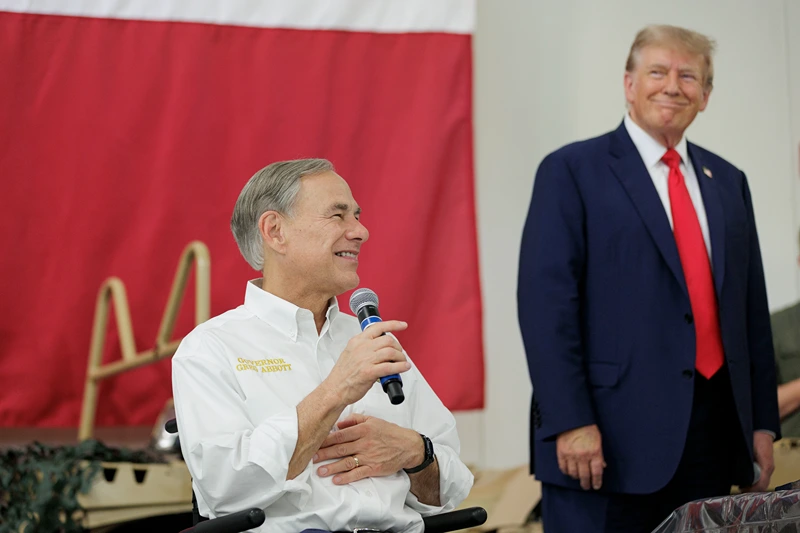 Former President Trump Visits The Southern Border With Texas Governor Abbott EDINBURG, TEXAS - NOVEMBER 19: Texas Governor Greg Abbott gives remarks with Former President Donald Trump at the South Texas International airport on November 19, 2023 in Edinburg, Texas. Trump and Abbott served meals to Texas National Guard and Texas DPS Troopers that are stationed at the U.S.-Mexico border over the Thanksgiving holiday. (Photo by Michael Gonzalez/Getty Images)