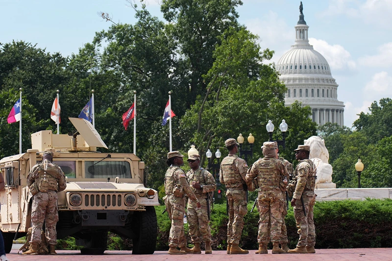 WASHINGTON, DC - AUGUST 14: Members of the National Guard stand by at Union Station on August 14, 2025 in Washington, DC. President Donald Trump announced plans to deploy federal officers and the National Guard to the District in order to place the DC Metropolitan Police Department under federal control and assist in crime prevention in the nation's capital. (Photo by Kevin Dietsch/Getty Images)