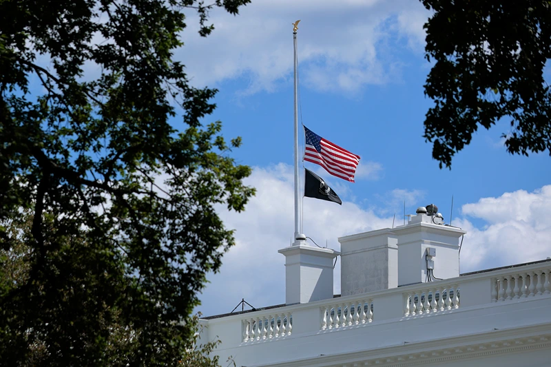 : The U.S. flag is lowered to half-staff above the White House on August 27, 2025 in Washington, DC. President Donald Trump ordered the flags lowered in memorial of the victims of today's mass shooting at a Minneapolis Catholic church and school. (Photo by Chip Somodevilla/Getty Images)