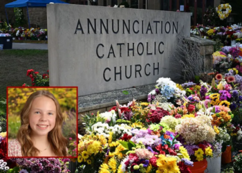 Flowers are seen outside the Annunciation Catholic Church in Minneapolis, Minnesota, on September 3, 2025, as the US vice president and second lady pay their respects at the site. On August 27 a shooter opened fire on school children attending a church service in Minneapolis, killing two pupils and wounding 17 people in the latest violent tragedy to jolt the United States. (Photo by Alex WROBLEWSKI / POOL / AFP) (Photo by ALEX WROBLEWSKI/POOL/AFP via Getty Images)