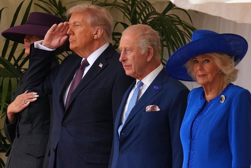 WINDSOR, ENGLAND - SEPTEMBER 17: President Donald Trump (2nd L), King Charles III, Queen Camilla (R) and Melania Trump walk to review the Guard of Honour at Windsor Castle on day two of the US President Donald Trump's second state visit to the UK on September 17, 2025 in Windsor, England. (Photo by Kirsty Wigglesworth - WPA Pool/Getty Images)