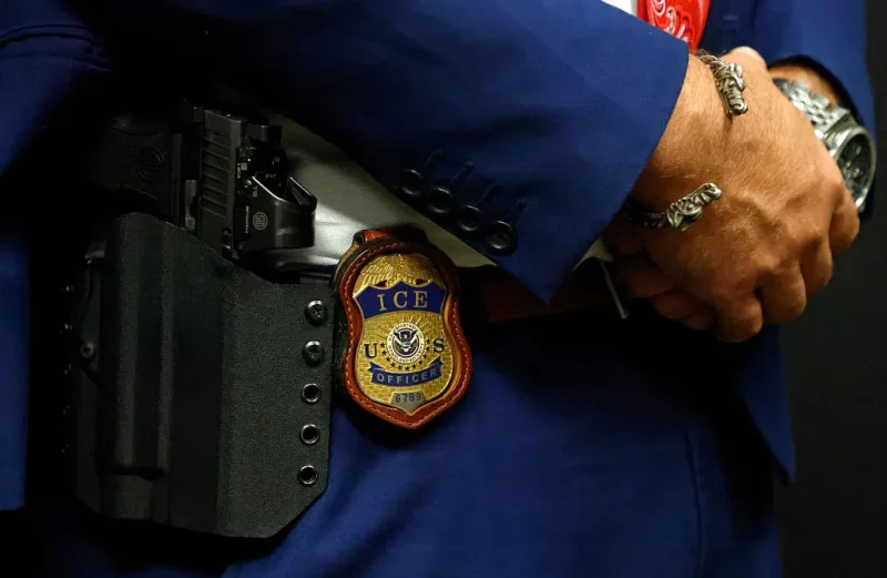 ARLINGTON, TEXAS - AUGUST 26: A detail view of the badge worn by Matthew Elliston, deputy assistant director of field operations at ICE headquarters in Washington. U.S. Immigration and Customs Enforcement (ICE) hold a major hiring event on August 26, 2025 in Arlington, Texas. The federal immigration agency is ramping up recruiting efforts nationwide. (Photo by Ron Jenkins/Getty Images)