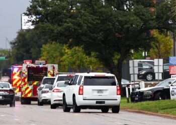 Law enforcement and emergency personnel respond near the scene of a shooting at a U.S. Immigration and Customs Enforcement detention facility in Dallas, Texas, on Sept. 24, 2025.