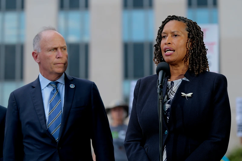 WASHINGTON, DC - AUGUST 15: Washington, DC Attorney General Brian Schwalb and Mayor Murial Bowser speak outside of the E. Barrett Prettyman U.S. Court House following a court hearing on August 15, 2025 in Washington, DC. Schwalb filed a lawsuit against the federal government claiming that the Trump Administration overstepped its authority when the federal government took over the Metropolitan Police Department and replaced the chief of police with a federal official. (Photo by Anna Moneymaker/Getty Images)