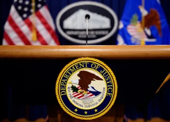 WASHINGTON, DC - MAY 6: The Department of Justice seal and logo are displayed before U.S. Attorney General Pam Bondi arrives for a news conference at the Department of Justice on May 6, 2025 in Washington, DC. The Justice Department along with the Drug Enforcement Administration (DEA) and the U.S. Attorney