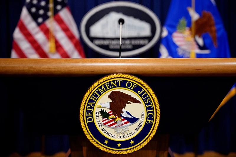 WASHINGTON, DC - MAY 6: The Department of Justice seal and logo are displayed before U.S. Attorney General Pam Bondi arrives for a news conference at the Department of Justice on May 6, 2025 in Washington, DC. The Justice Department along with the Drug Enforcement Administration (DEA) and the U.S. Attorney