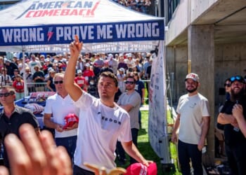 Charlie Kirk throws hats to the crowd after arriving at Utah Valley University on Sept. 10, 2025, in Orem, Utah.