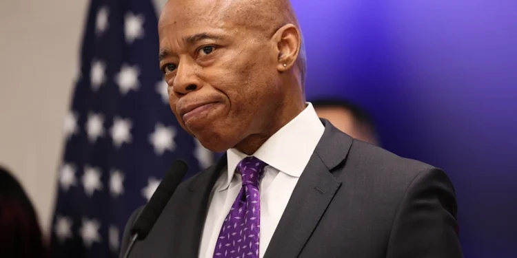 NEW YORK, NEW YORK - FEBRUARY 20: New York Mayor Eric Adams listens to questions from reporters during a press conference at NYPD