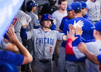 TORONTO, CANADA - AUGUST 13: Matt Shaw #6 of the Chicago Cubs celebrates in the dugout after hitting a solo-home run in the fifth inning of their MLB game against the Toronto Blue Jays at Rogers Centre on August 13, 2025 in Toronto, Ontario, Canada. (Photo by Cole Burston/Getty Images)