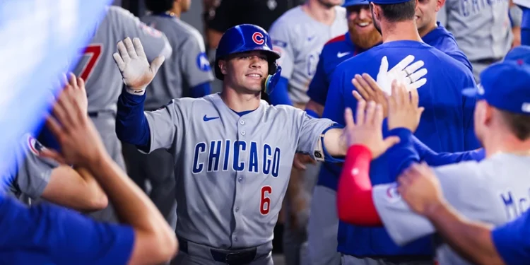 TORONTO, CANADA - AUGUST 13: Matt Shaw #6 of the Chicago Cubs celebrates in the dugout after hitting a solo-home run in the fifth inning of their MLB game against the Toronto Blue Jays at Rogers Centre on August 13, 2025 in Toronto, Ontario, Canada. (Photo by Cole Burston/Getty Images)