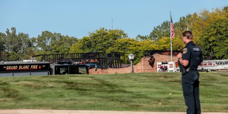 GRAND BLANC, MICHIGAN - SEPTEMBER 28: The burned church as emergency services respond to a shooting and fire at the Church of Jesus Christ of Latter-day Saints on September 28, 2025 in Grand Blanc, Michigan. Police said there are multiple victims and the shooter is down. (Photo by Bill Pugliano/Getty Images)