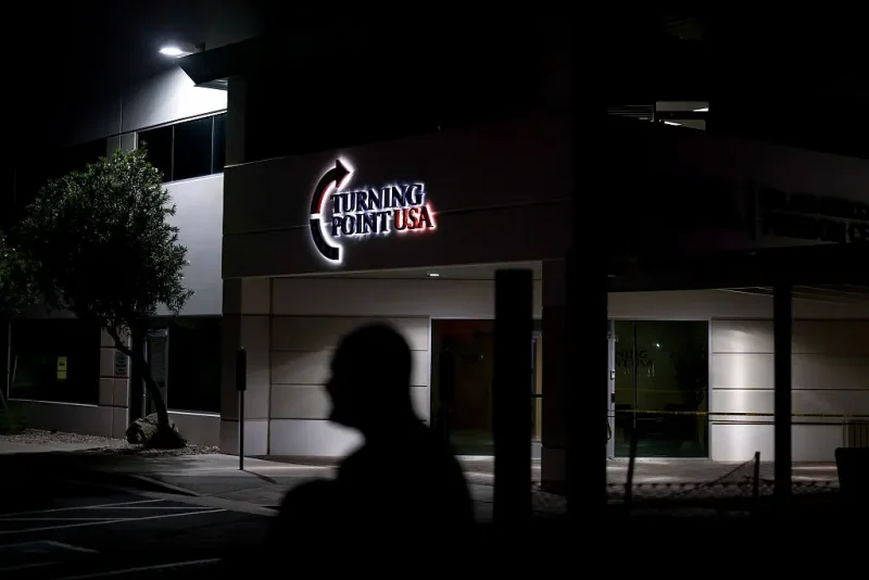 PHOENIX, ARIZONA - SEPTEMBER 11: A man stands near a memorial for Charlie Kirk at the Turning Point USA headquarters on September 11, 2025 in Phoenix, Arizona. Kirk the CEO and co-founder of Turning Point USA was shot and killed on Wednesday in Utah. on September 11, 2025 in Phoenix, Arizona. (Photo by Eric Thayer/Getty Images)