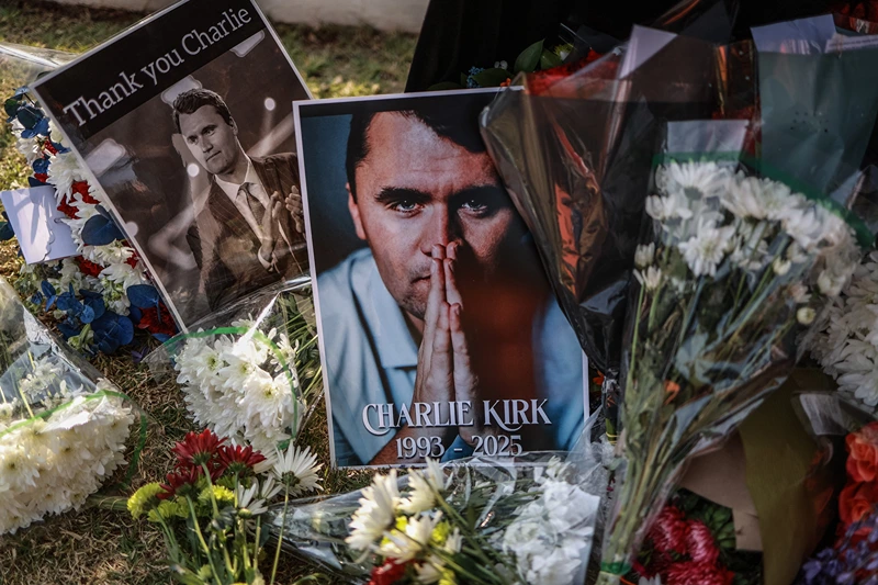 TOPSHOT - A general view of a wreath laid by mourners outside the US Embassy in Pretoria on September 11, 2025 following the fatal shooting of US youth activist and influencer Charlie Kirk while speaking during an event at Utah Valley University in Orem, Utah, United States. US youth activist and influencer Charlie Kirk, a major ally of President Donald Trump, was shot on September 10, 2025 at a US university. Kirk was speaking at an event at Utah Valley University when the attack happened. (Photo by Phill Magakoe / AFP) (Photo by PHILL MAGAKOE/AFP via Getty Images)
