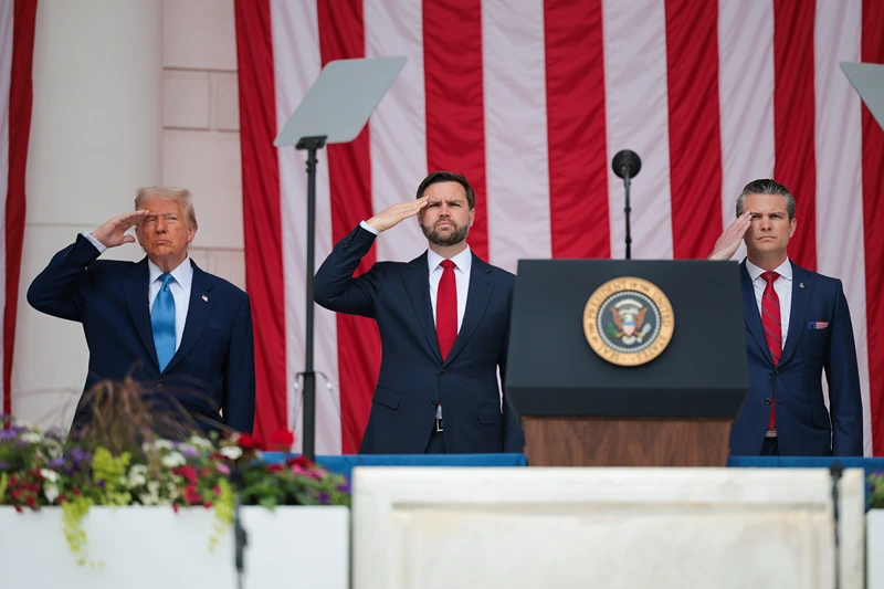 ARLINGTON, VIRGINIA - MAY 26: (L-R) U.S. President Donald Trump, U.S. Vice President JD Vance, and U.S. Secretary of Defense Pete Hegseth greet visitors during the Memorial Day wreath-laying ceremony at the Memorial Amphitheater in Arlington National Cemetery on May 26, 2025 in Arlington, Virginia. Memorial Day is observed on the last Monday in May each year to honor and mourn U.S. military personnel who died while serving in the United States Armed Forces. (Photo by Kayla Bartkowski/Getty Images)