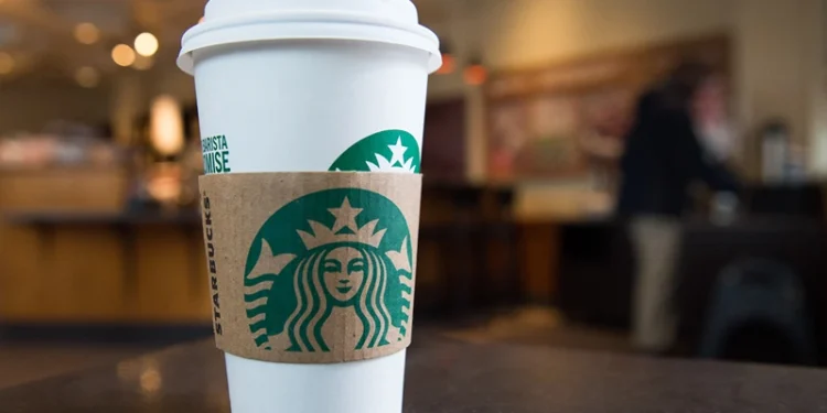 A Starbucks coffee cup is seen inside a Starbucks Coffee shop in Washington, DC, April 17, 2018, following the company