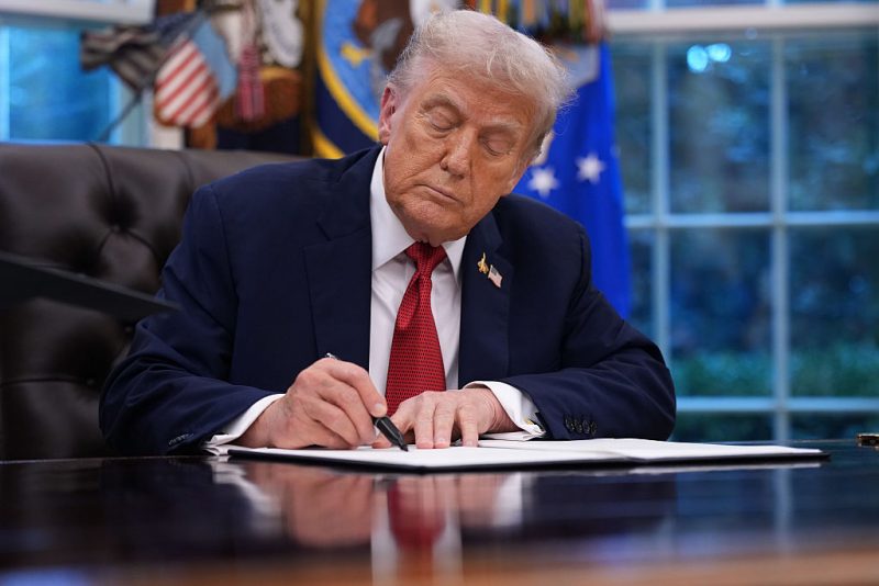 WASHINGTON, DC - SEPTEMBER 25: U.S. President Donald Trump holds signs an executive order in the Oval Office of the White House on September 25, 2025 in Washington, DC. Trump signed proclamations and an executive order, including approving a partial sale of TikTok’s U.S. operations, following a 2024 law requiring parent company ByteDance to divest or face a ban. (Photo by Andrew Harnik/Getty Images)