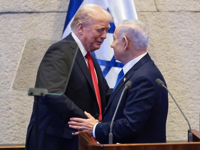 PHOTO: President Trump talks with Israel's Prime Minister Benjamin Netanyahu at the Knesset, Israel's parliament, Monday, Oct. 13, 2025, in Jerusalem. (Evelyn Hockstein/Pool via AP)