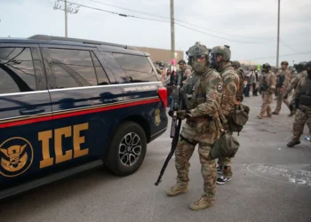 Immigration and Customs Enforcement (ICE) agents armed with less-lethal weapons gather outside an ICE processing center during a protest in Broadview, Illinois, on September 19, 2025. US President Donald Trump ordered increased federal law enforcement presence in Illinois and stepped-up immigration enforcement actions by the Department of Homeland Security. (Photo by OCTAVIO JONES / AFP) (Photo by OCTAVIO JONES/AFP via Getty Images)