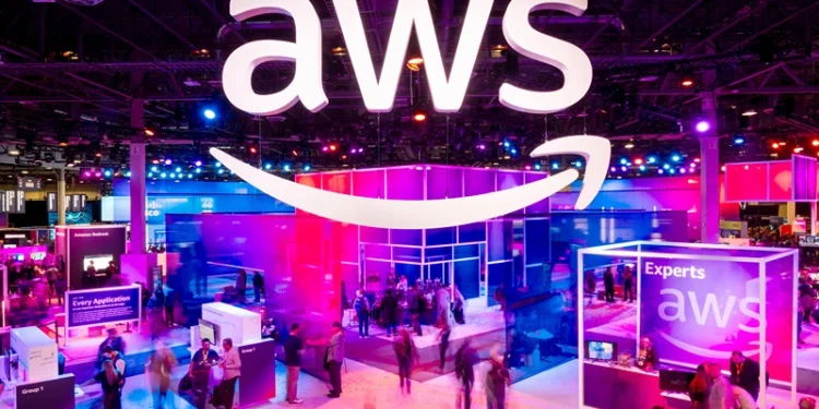 LAS VEGAS, NEVADA - NOVEMBER 28: Attendees walk through an expo hall at AWS re:Invent 2023, a conference hosted by Amazon Web Services, at The Venetian Las Vegas on November 28, 2023 in Las Vegas, Nevada. (Photo by Noah Berger/Getty Images for Amazon Web Services)