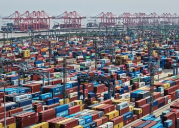 TOPSHOT - An aerial view shows cargo containers stacked at a port in Shanghai on April 20, 2025. (Photo by AFP) / China OUT (Photo by STR/AFP via Getty Images)
