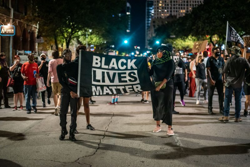 AUSTIN, TX - JULY 26: people march in the street after a vigil for Garrett Foster on July 26, 2020 in downtown Austin, Texas. Garrett Foster, 28, who was armed and participating in a Black Lives Matter protest, was shot and killed after a chaotic altercation with a motorist who allegedly drove into the crowd. The suspect, who has yet to be identified, was taken into custody. (Photo by Sergio Flores/Getty Images)