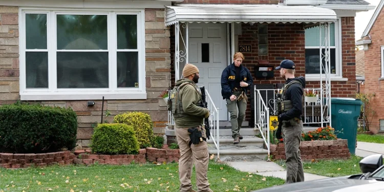Members of the FBI Joint Terrorism Task Force search a home in Dearborn, Michigan, on October 31, 2025. FBI Director Kash Patel said Friday that the agency had thwarted a "potential terrorist attack" planned in the northern state of Michigan over Halloween weekend. Patel said the FBI arrested multiple subjects. (Photo by JEFF KOWALSKY / AFP) (Photo by JEFF KOWALSKY/AFP via Getty Images)