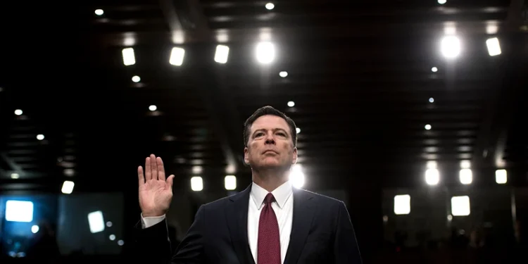 Ousted FBI director James Comey is sworn in during a hearing before the Senate Select Committee on Intelligence on Capitol Hill June 8, 2017 in Washington, DC. Fired FBI director James Comey took the stand Thursday in a crucial Senate hearing, repeating explosive allegations that President Donald Trump badgered him over the highly sensitive investigation Russia