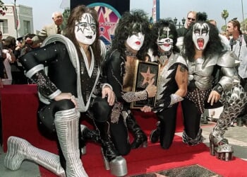 HOLLYWOOD, : Members of the rock band Kiss (from left to right): Ace Frehley, Paul Stanley, Peter Criss and Gene Simmons pose by the star they received during a Hollywood Walk of Fame ceremony 11 August 1999 in Hollywood, Ca. The group, known for their theatrical stage performances, has sold 80 million records over their 26 year career. AFP PHOTO/Vince BUCCI (Photo credit should read Vince Bucci/AFP via Getty Images)