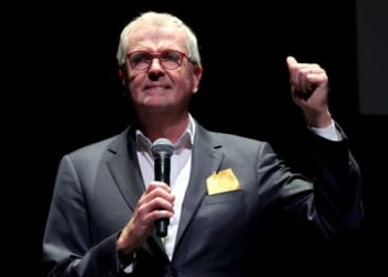 New Jersey Governor Phil Murphy, seen in a 2024 photo, was again reported to be out of the country as the State of Emergency was declared.