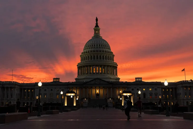A view of the U.S. Capitol is seen at sunset on September 30, 2025, in Washington, DC. Lawmakers face a looming deadline to reach a bipartisan funding agreement before midnight, or risk triggering a federal government shutdown. (Photo by Mehmet Eser / Middle East Images via AFP) (Photo by MEHMET ESER/Middle East Images/AFP via Getty Images)
