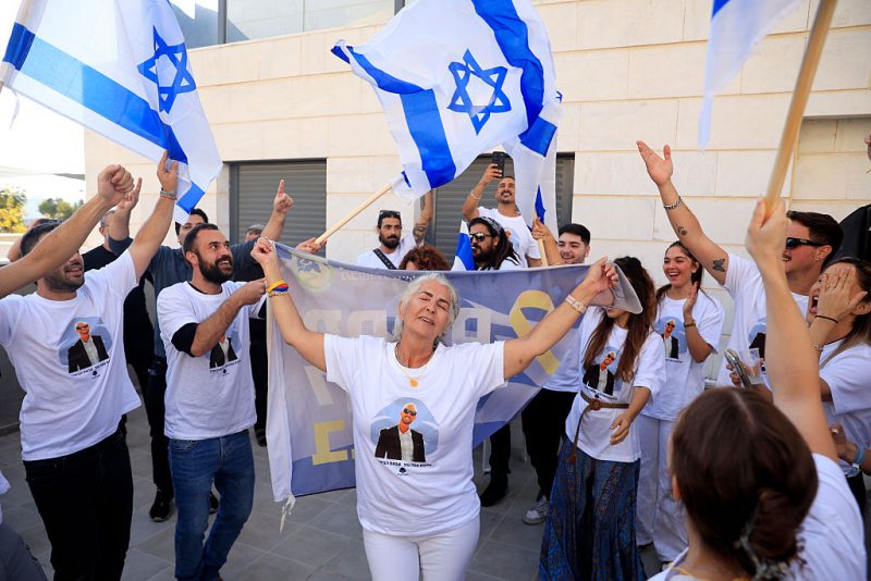 TEL AVIV, ISRAEL - OCTOBER 13: Families and friends of Gaza hostage Elkana Bohbot react as they watch the hostage release live stream from the home of Bohbot's mother in Mevaseret Zion on October 13, 2025 in Tel Aviv, Israel. The ceasefire deal between Israel and Hamas has brought an end to the two years of war that followed the attacks of Oct. 7, 2023. A condition of the deal was the immediate return of 48 hostages held in Gaza, around 20 of whom were believed to be alive. (Photo by Amir Levy/Getty Images)