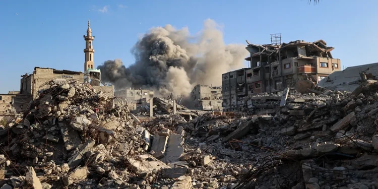 TOPSHOT - Smoke billows following an Israeli strike that targeted a building in the Bureij camp for Palestinian refugees in the central Gaza Strip on October 19, 2025. Gaza