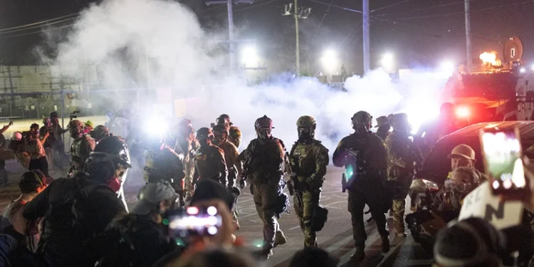BROADVIEW, ILLINOIS - SEPTEMBER 27: Federal law enforcement agents attack demonstrators protesting outside of an immigrant processing center with a barrage of tear gas and pepper balls on September 27, 2025 in Broadview, Illinois. The demonstrators were protesting a recent surge in ICE apprehensions in the Chicago area, part of a push by the Trump administration dubbed Operation Midway Blitz. (Photo by Scott Olson/Getty Images)