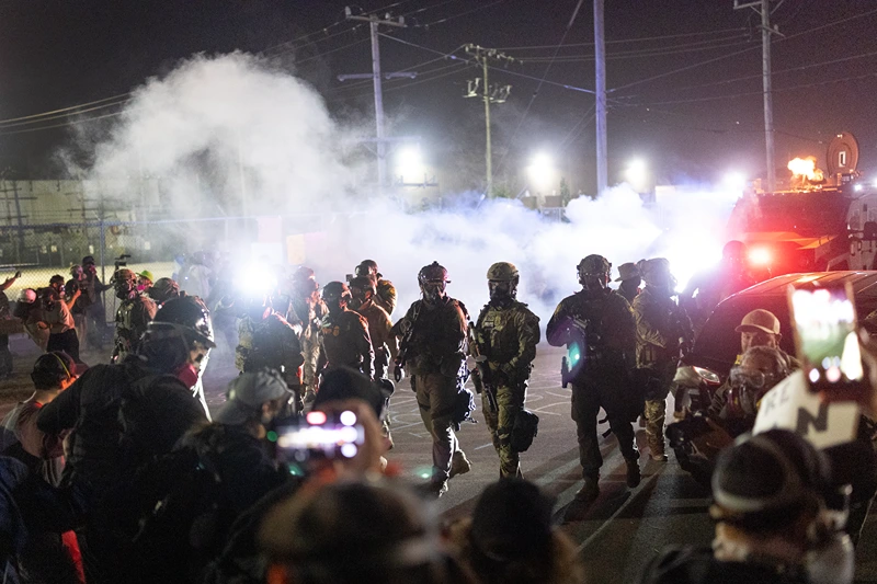 BROADVIEW, ILLINOIS - SEPTEMBER 27: Federal law enforcement agents attack demonstrators protesting outside of an immigrant processing center with a barrage of tear gas and pepper balls on September 27, 2025 in Broadview, Illinois. The demonstrators were protesting a recent surge in ICE apprehensions in the Chicago area, part of a push by the Trump administration dubbed Operation Midway Blitz. (Photo by Scott Olson/Getty Images)