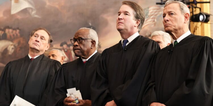 Associate Supreme Court Justices Samuel Alito, Clarence Thomas, and Brett Kavanaugh, and U.S. Chief Justice John Roberts, look on during inauguration ceremonies in the Rotunda of the U.S. Capitol on Jan. 20, 2025, in Washington, D.C.